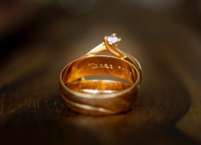 Two gold rings, one stamped with a hallmark